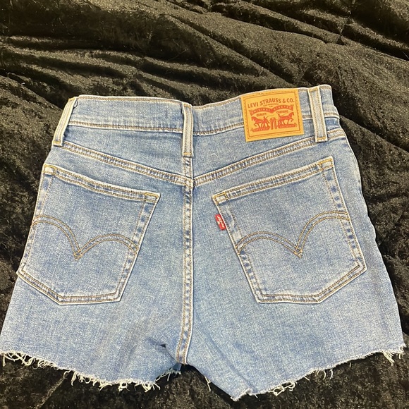High Rise Blue Ripped Levi Shorts - Picture 3 of 5